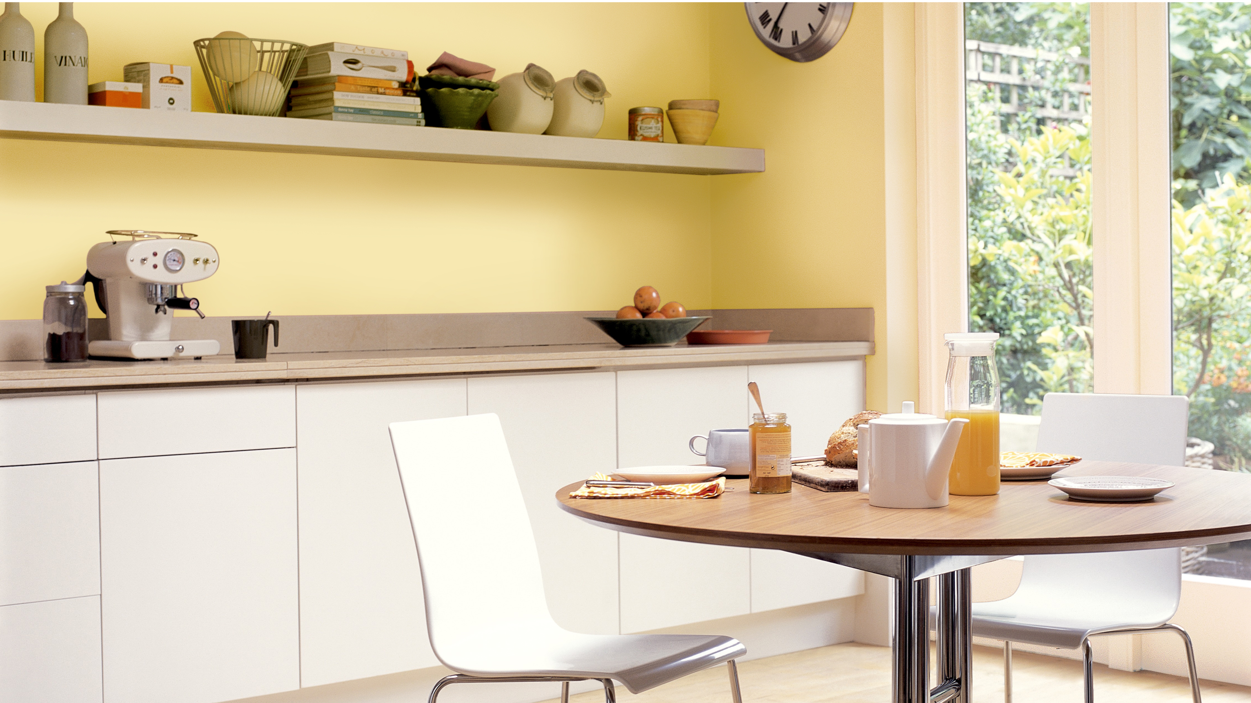 A bright yellow kitchen If your kitchen has dark brown walls but what you actually want is an airy family kitchen, why not switch the brown for a bright, sunny yellow.