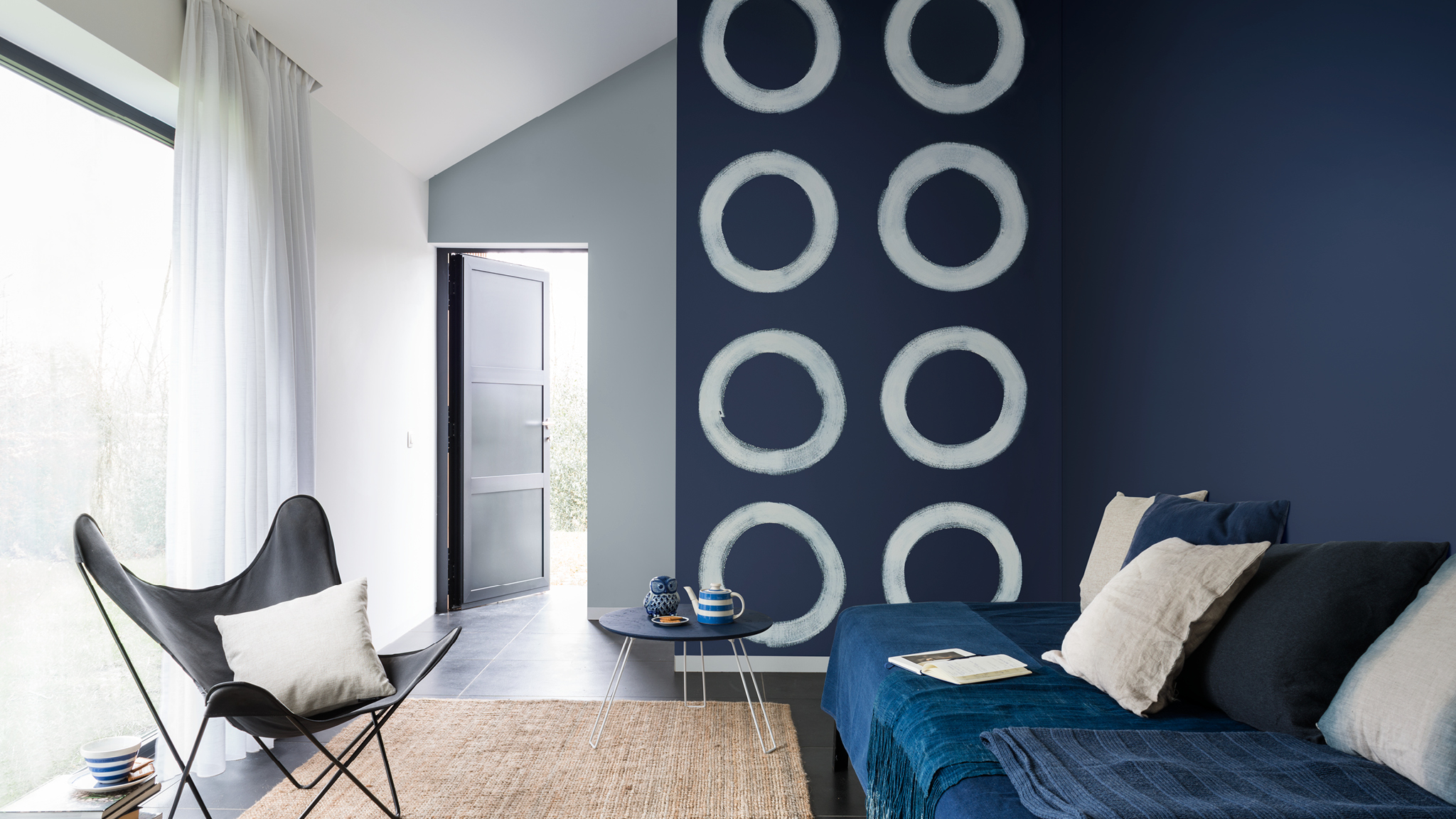 Blue circles wall The liberating use of freehand painted shapes can give a dynamic creativity to your home.