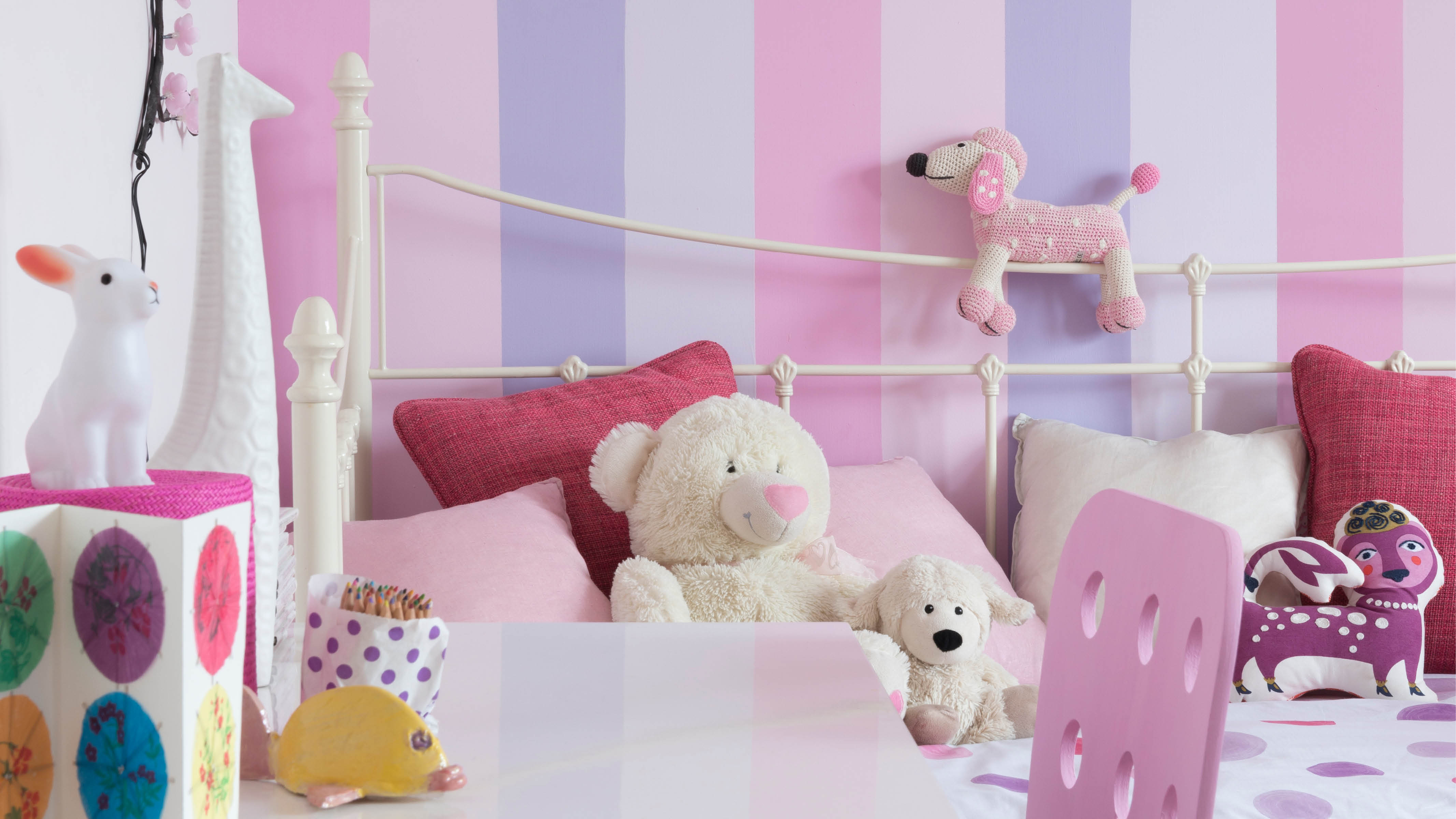 Nursery with bold pink stripes Warm and passionate, strong pink and lilacs are striking shades when teamed with cool neutrals, particularly when used together to create a vibrant stripe effect.