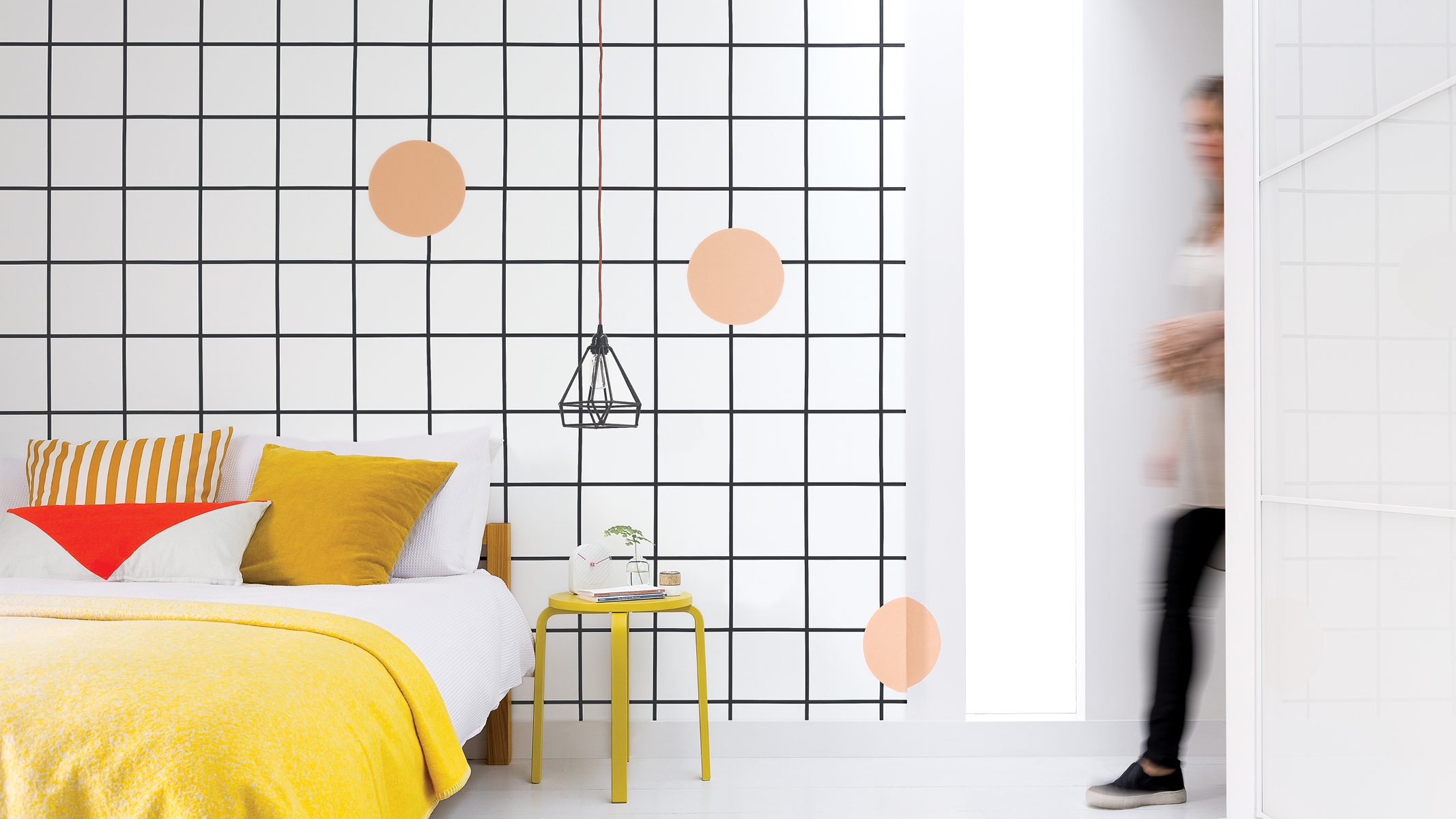 Paint a grid on your feature wall For a contemporary decorating idea with an edgy vibe, you can’t go wrong with a monochrome grid.